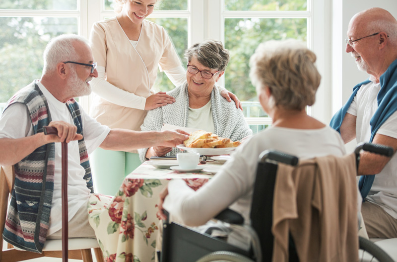 happy-seniors-having-a-cake-in-a-nursing-home_WEB